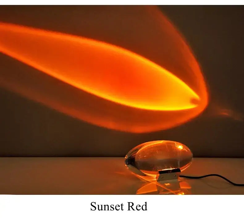 Modern oval crystal led table lamp with sunset red translucent glass casting warm orange glow for bedroom decorbites crystal led ambient lighting
