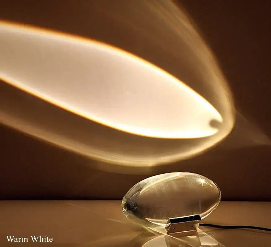 Modern oval crystal led table lamp with warm white light, translucent glass base, and sleek design for bedroom decorbites lighting