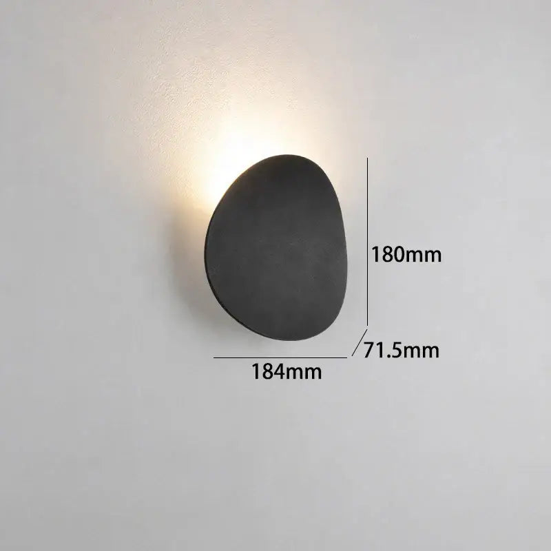 Black matte-finished led wall lamp with organic egg-shaped design for modern gray and dark gray garden lighting
