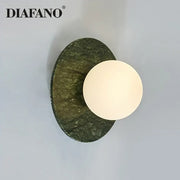 Diafano modern oval green marble wall lamp with textured stone base and white circular light fixture for living room decorbites green marble wall sconce