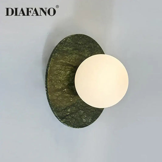 Diafano modern oval green marble wall lamp with textured stone base and white circular light fixture for living room decorbites green marble wall sconce
