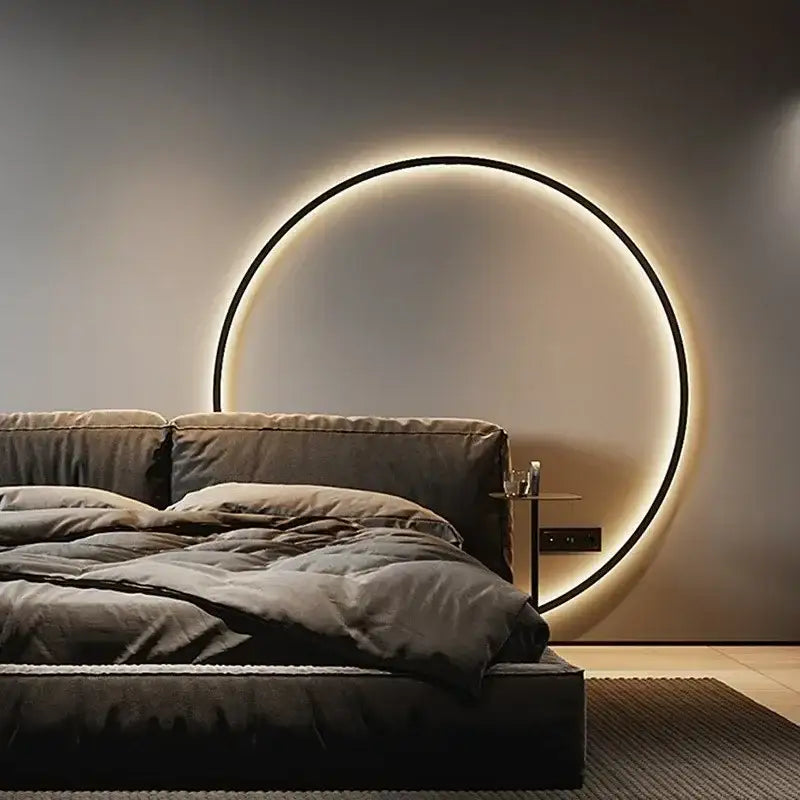 Modern oval led wall sconce with a sleek black frame and warm glowing illumination by decorbites led wall