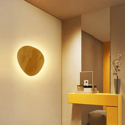 Warm-toned modern oval led wooden wall lamp with organic shape and smooth finish for bedroom decorbites led wooden use