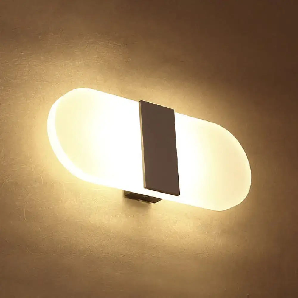 Modern oval rectangular convex led wall sconce with frosted white diffuser and black central accent for bedroom lighting