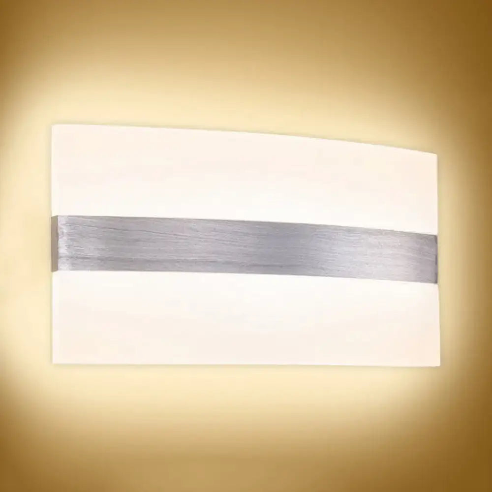 Modern oval rectangular convex wall sconce with a sleek white diffuser and brushed silver horizontal accent strip for bedroom lighting
