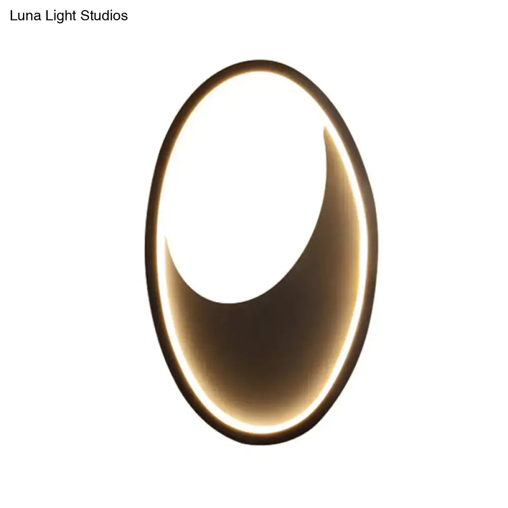Modern oval white and black led wall lamp with gold-toned frame providing soft ambient lighting 110v-120v