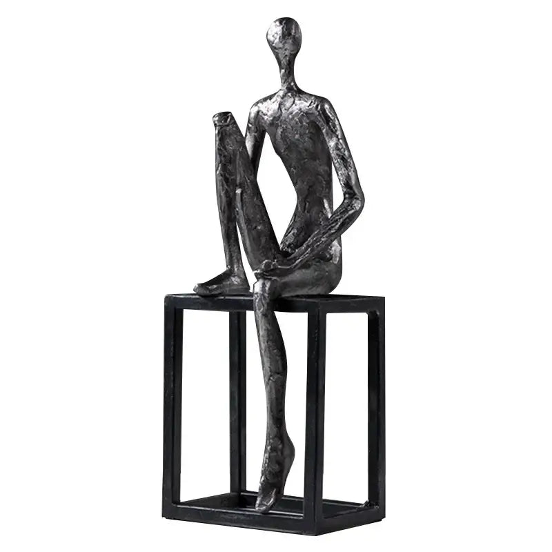 Modern oxidized silver abstract thinkers sculpture with textured dark gray surface on minimalist black cube base decorbites abstract thinkers