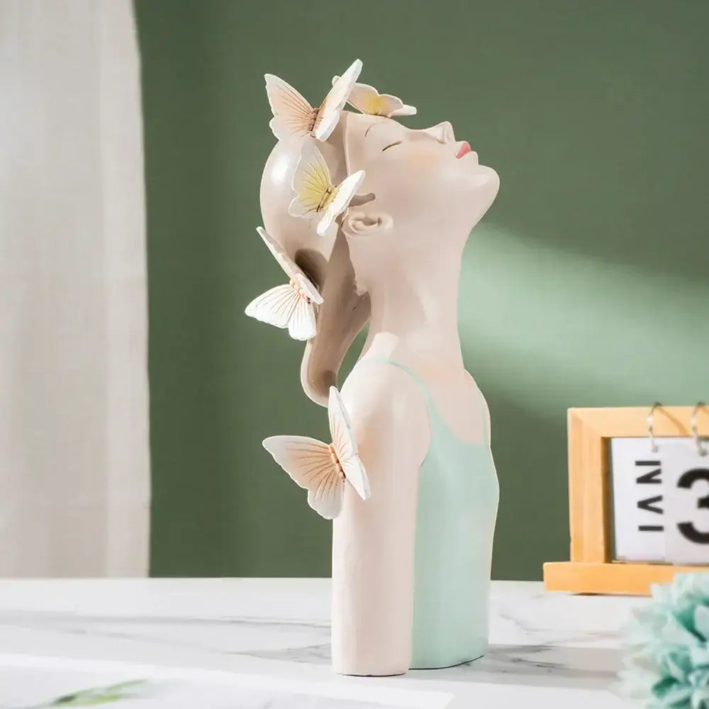 Delicate porcelain butterfly girl sculpture with closed eyes and pastel butterflies for modern bedroom decor
