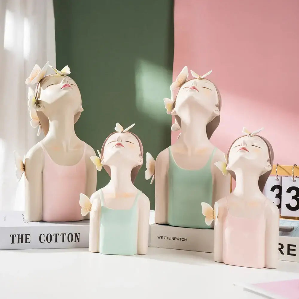 Pastel-colored resin butterfly girl sculptures featuring ballet dancers with butterfly accents for bedroom decor