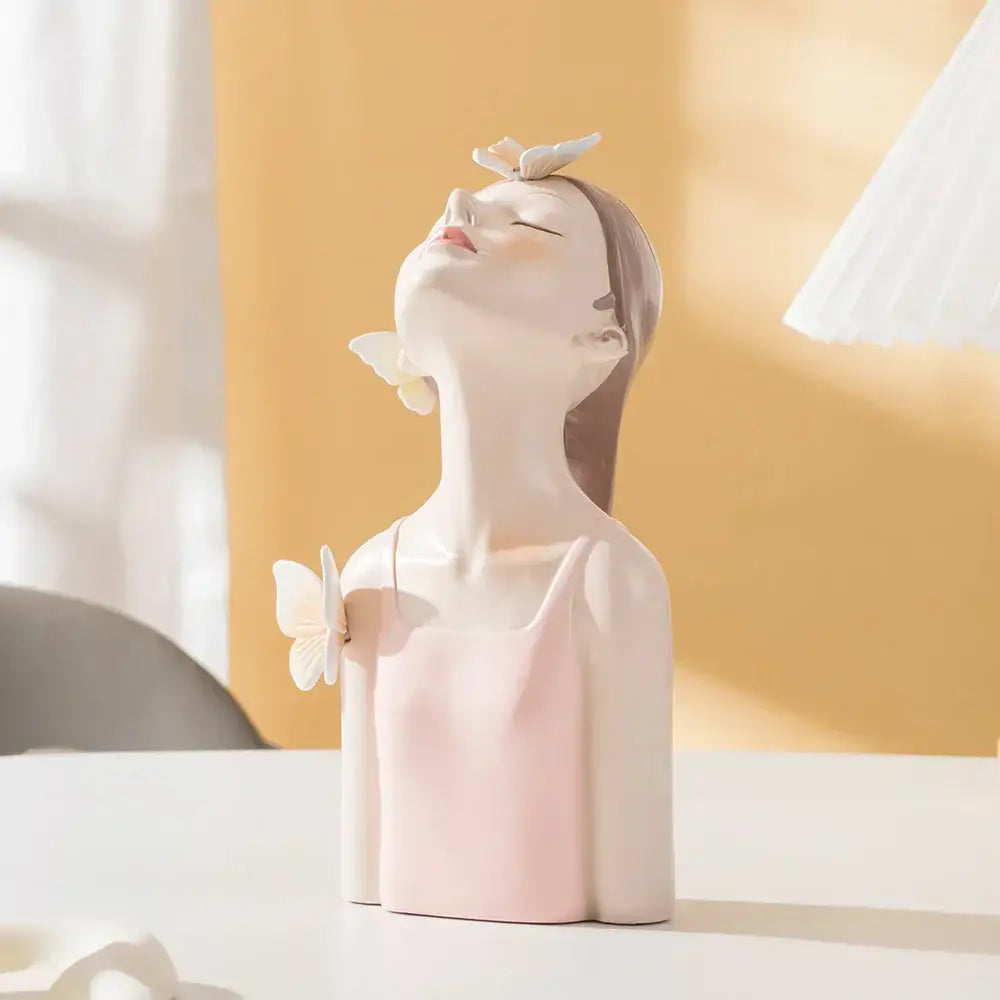 Modern pastel pink ceramic butterfly girl sculpture with closed eyes and butterflies for bedroom decor figurines
