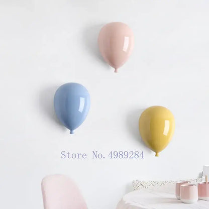 Modern pastel ceramic balloon wall hanging decoration in glossy pink blue and yellow for children room