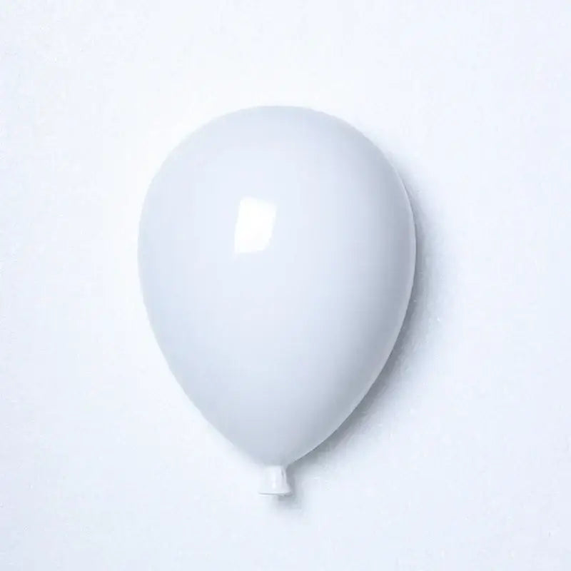 Modern pastel ceramic wall hanging decoration featuring a smooth matte white latex balloon for children room