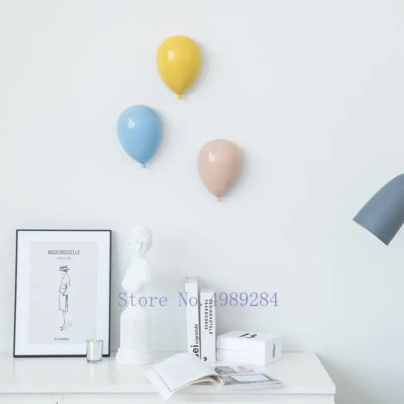 Modern pastel ceramic balloon wall hanging decoration in yellow blue and blush pink glossy ceramic for children room