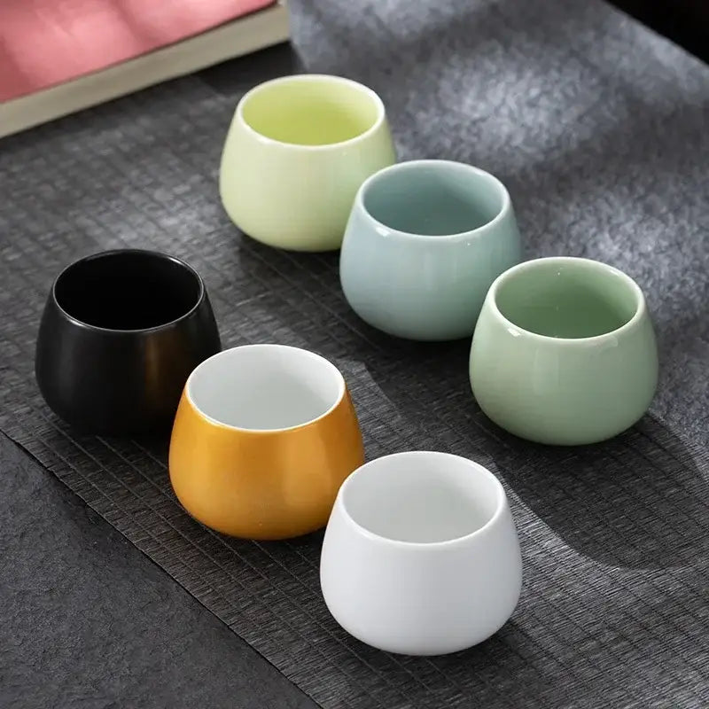 Set of six modern pastel ceramic kungfu tea cups in black white yellow light green mint and pale yellow for dining room use