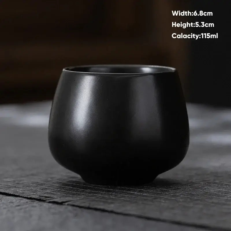 A sleek matte black ceramic kungfu tea cup with rounded body from decorbites modern pastel ceramic kungfu set