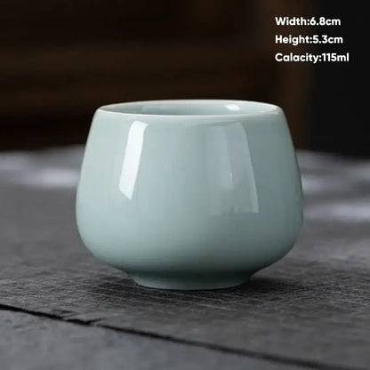 A smooth light green ceramic kungfu tea cup with a glossy finish from decorbites ceramic kungfu set for modern dining