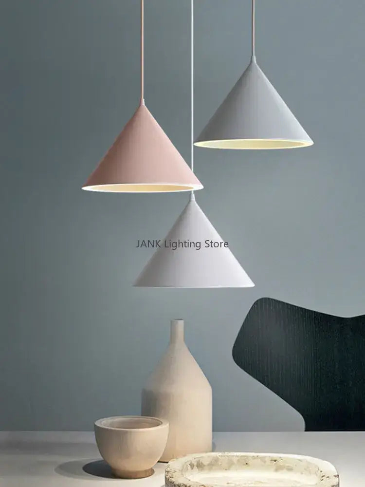 Three modern pendant lights in pastel pink white and gray with decorbites cone shape and three lighting methods