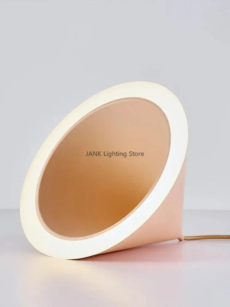 A sleek modern pendant light with a peach pastel cone shape and bright white rim featuring three lighting methods by decorbites