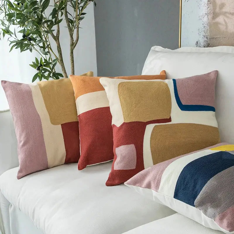 A set of four modern pastel geometric cushion cover throw pillows in textured fabric for living room decorbites geometric cushion decor