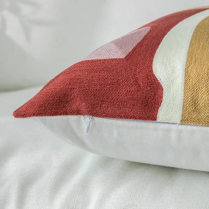 A modern terracotta red cream and mustard yellow geometric cushion cover with textured fabric for living room decorbites decor
