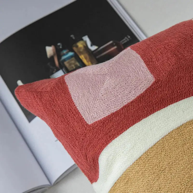Modern pastel geometric cushion cover with terracotta red pink and cream woven sections for stylish decorbites geometric cushion decor