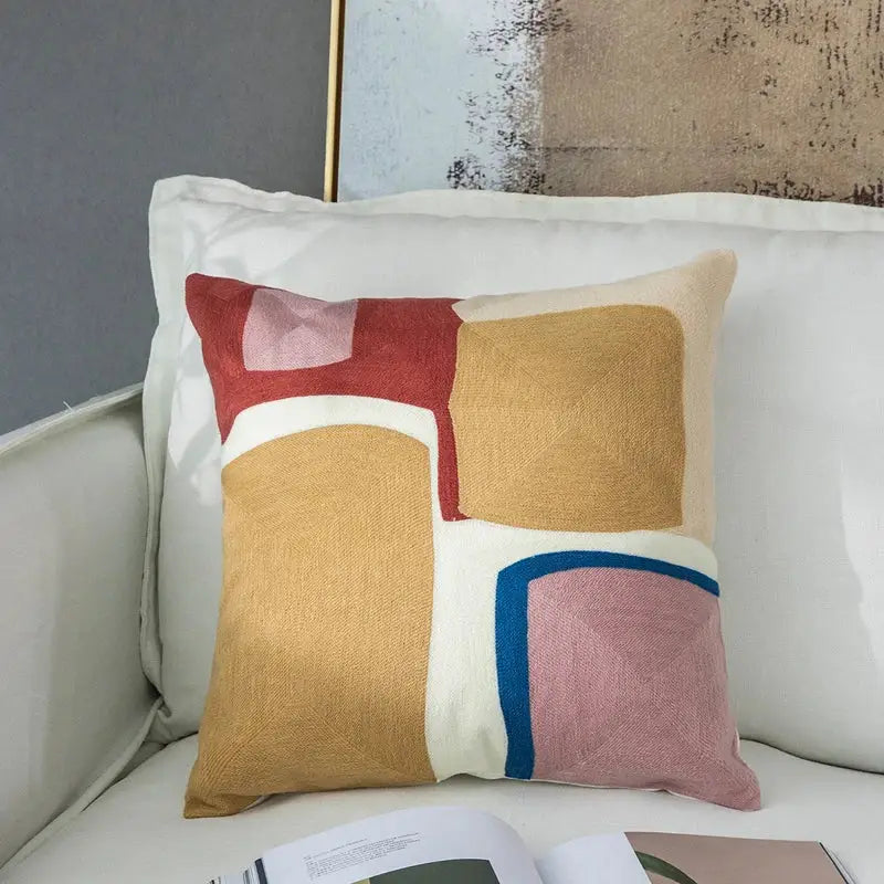 Modern pastel geometric cushion cover with embroidered red, mustard yellow, pink, and cream fabric for living room decorbites geometric cushion