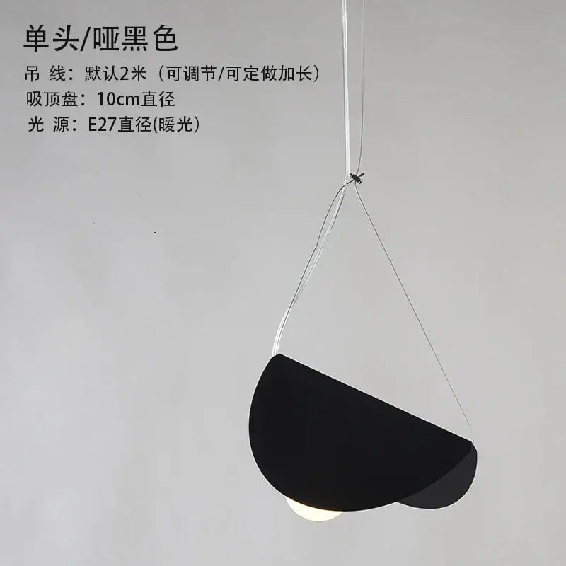 Black matte geometric iron pendant light with minimalist semi-circular shade and thin white cords for dining room decorbites geometric iron