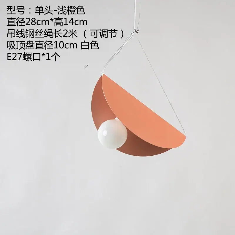 Modern pastel geometric iron pendant light with shallow orange shade and white bulb for dining room decorbites geometric iron pendant