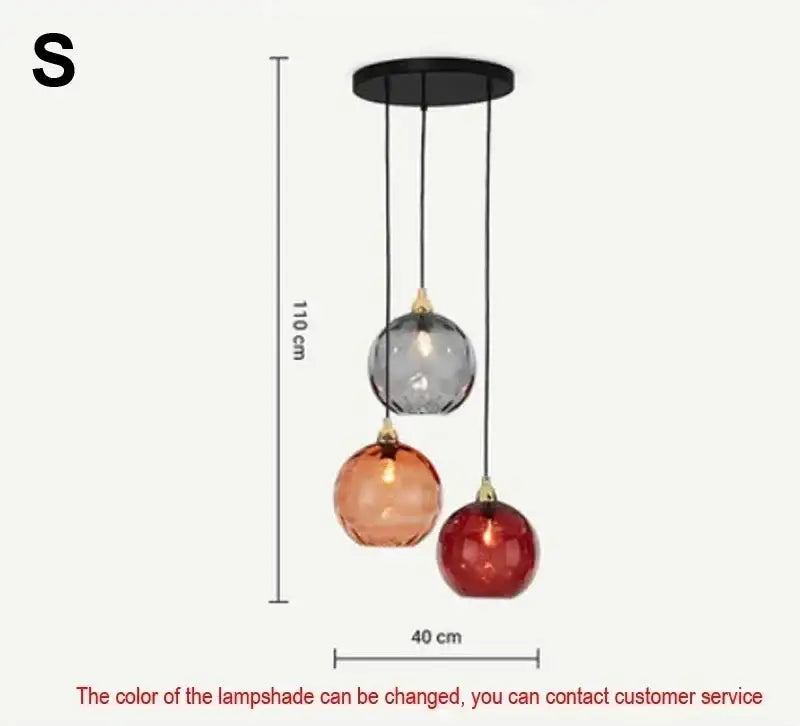 Modern pendant light with seven pastel glass shades in gray amber and red hues in polished chrome for dining rooms