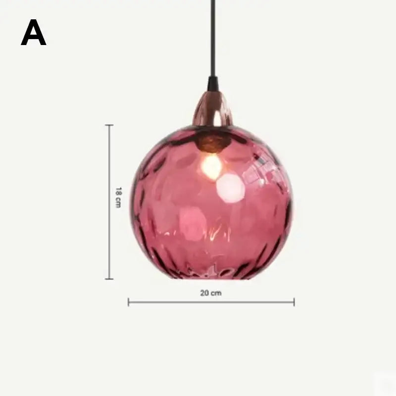 Modern pastel glass pendant light with seven textured pink globes and polished chrome rose gold metal fixture for dining room