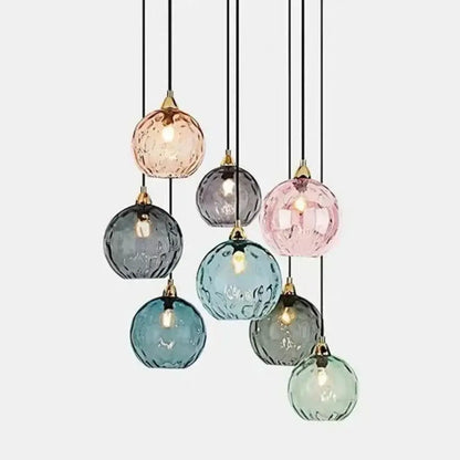 A modern pastel glass 7-globe pendant light with polished chrome fittings for dining room use in square meters