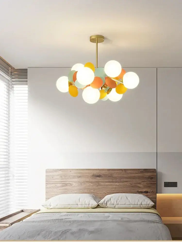 Modern pastel glass hanging ceiling lamp with brass rod and spherical bulbs in white yellow orange and mint green decorbites glass hanging