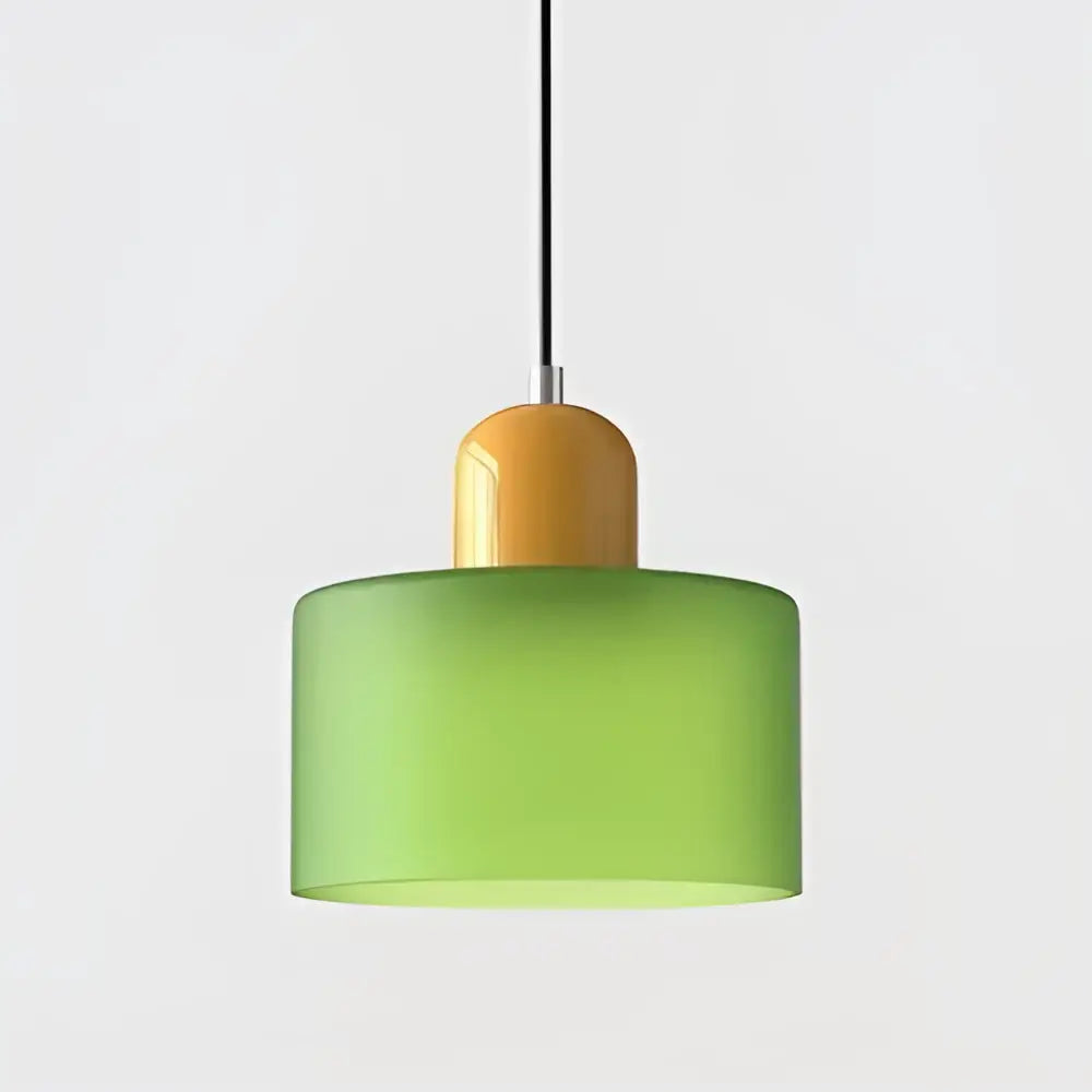 Modern pendant light with frosted green glass shade and amber top cap for kitchen and dining room use