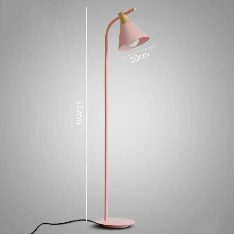 A slender pink decorbites iron macaron floor lamp with a curved neck wooden accent and conical shade for living room decor