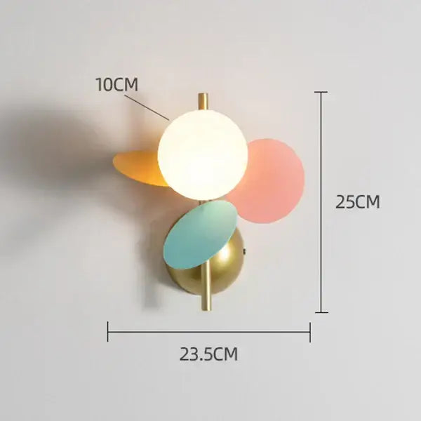 Modern pastel macaron acrylic wall lamp with central white orb and orange pink discs on gold base for kids bedroom decorbites colorful macaron
