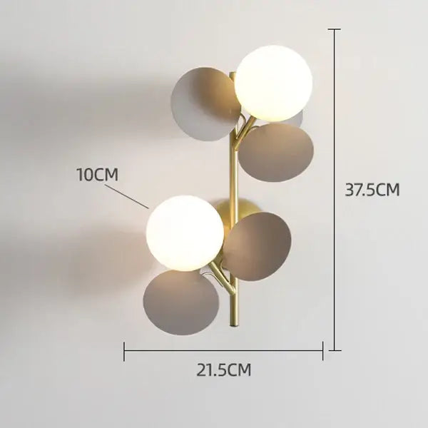 Modern gold-toned wall lamp with five spherical macaron acrylic shades in muted earth tones for children’s decorbites colorful macaron bedroom lighting