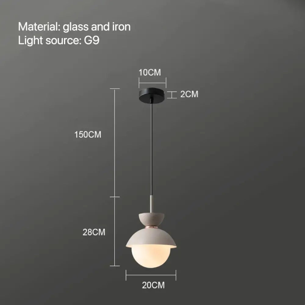 Minimalist pendant lamp with frosted glass ball and matte iron fixture designed for modern interiors decorbites glass ball