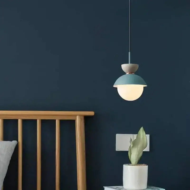 Modern pastel matte ceramic glass ball pendant lamp with teal and beige shade suspended by black cord for kitchen decorbites glass ball pendant lamp