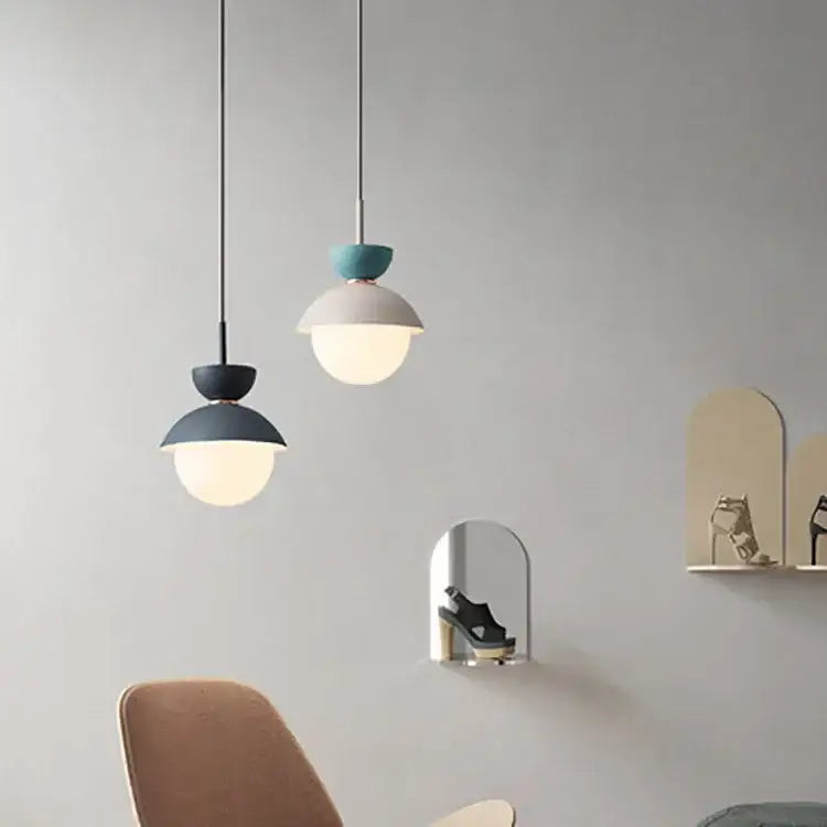 Two modern pendant lamps with matte teal and black ceramic shades and white glass ball globes by decorbites glass ball pendant