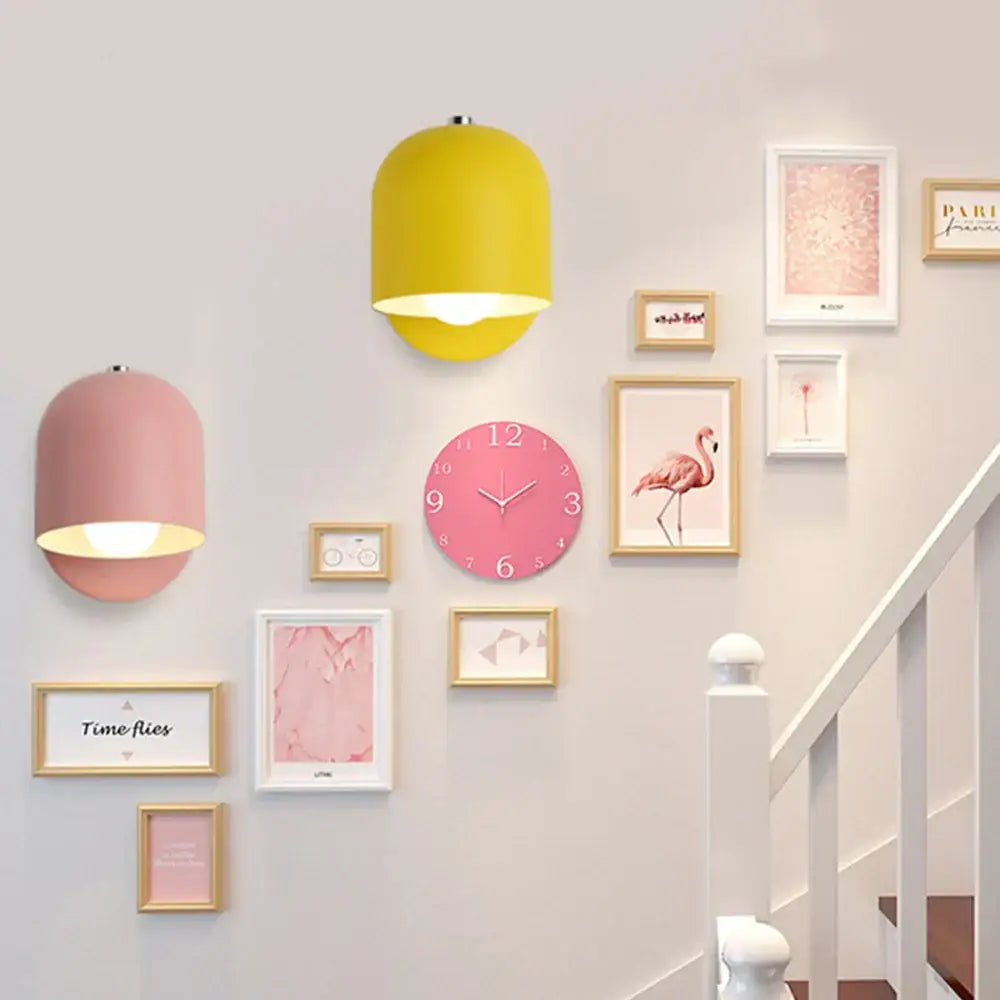 Yellow cylindrical pastel matte iron wall light fixture with warm glow for modern bedroom lighting
