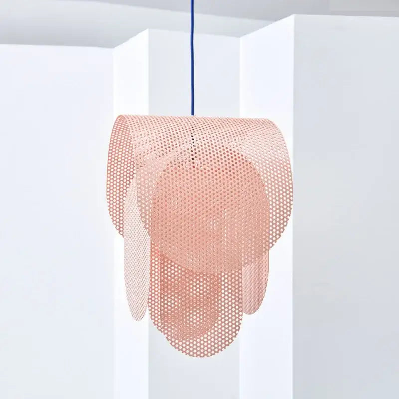A delicate blush pink perforated metal fishing net pendant light with layered circular shapes for decorbites kids room