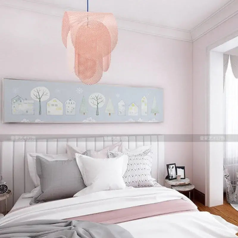 A delicate peach-colored mesh fishing net pendant light with layered circular design for decorbites kids room
