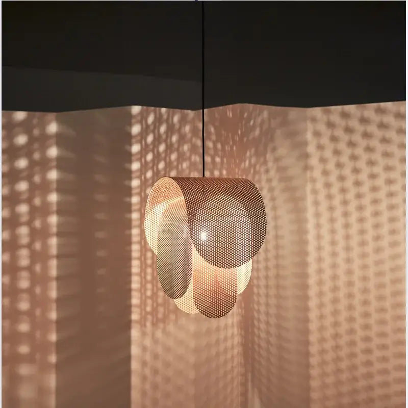Modern pastel mesh fishing net pendant light features warm-toned perforated metal with layered design for decorbites kids room