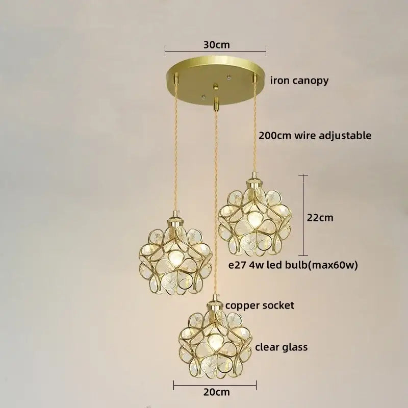 Gold-toned three-light pendant lights with clear colorful glass led flower globes and adjustable copper sockets for dining room decorbites colorful glass design