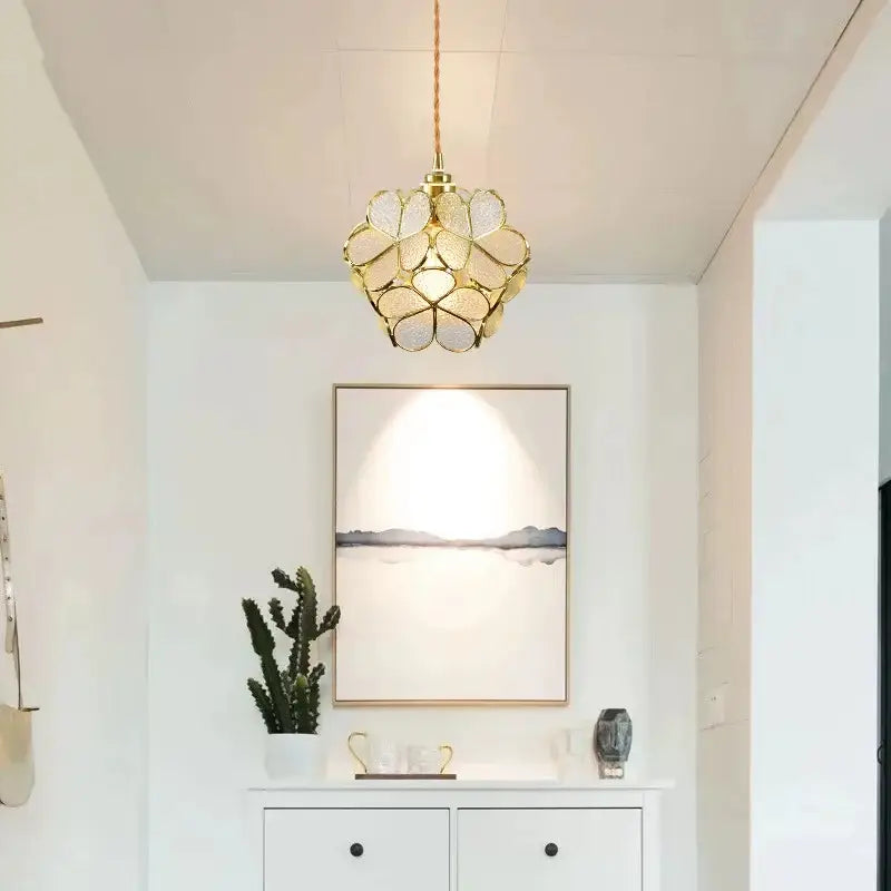 Gold-toned pendant lights with floral textured glass panels from decorbites colorful glass led dining room collection