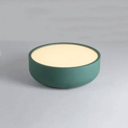 A sleek modern circular led ceiling light with matte teal exterior and warm cream top for bedroom decorbites circular led