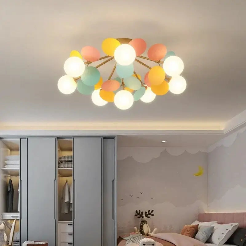 Modern pastel spherical frost glass ceiling chandelier with pastel balloon-style lights and gold-toned frame decorbites frost glass