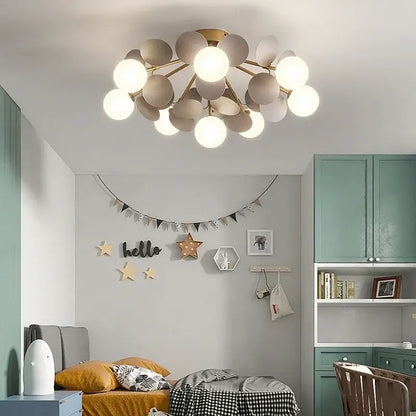 Modern pastel spherical frost glass ceiling chandelier with warm white bulbs on gold-toned decorbites frost glass frame