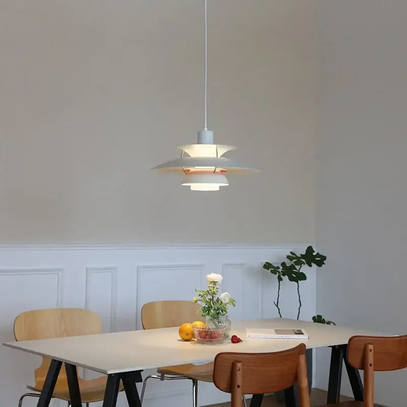 Modern pastel tiered led chandelier pendant light in white with minimalist design and subtle copper accents for kitchen decor