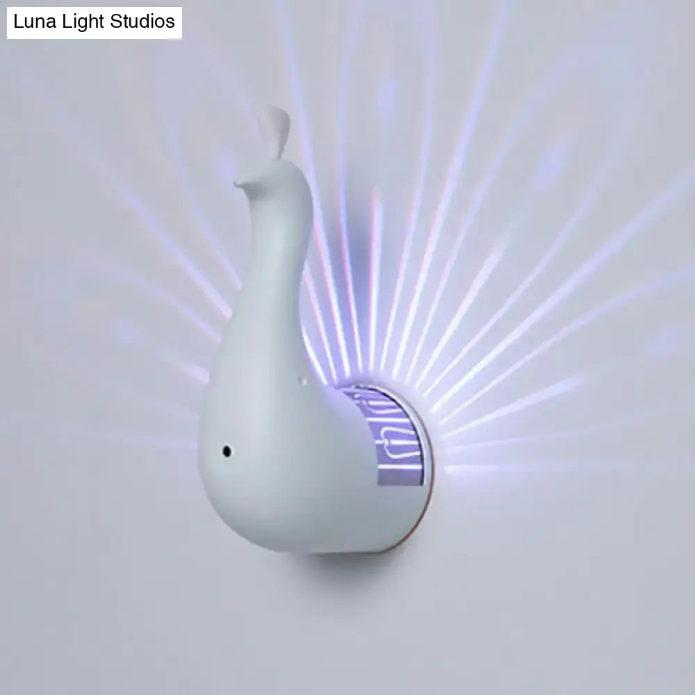 White peacock wall sconce with sleek modern design and glowing purple light rays for bedroom rainbow projection light
